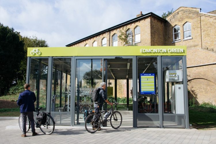 Cyclehoop Cycle Hub in Edmonton London with a cyclist entering the hub to park their bicycle